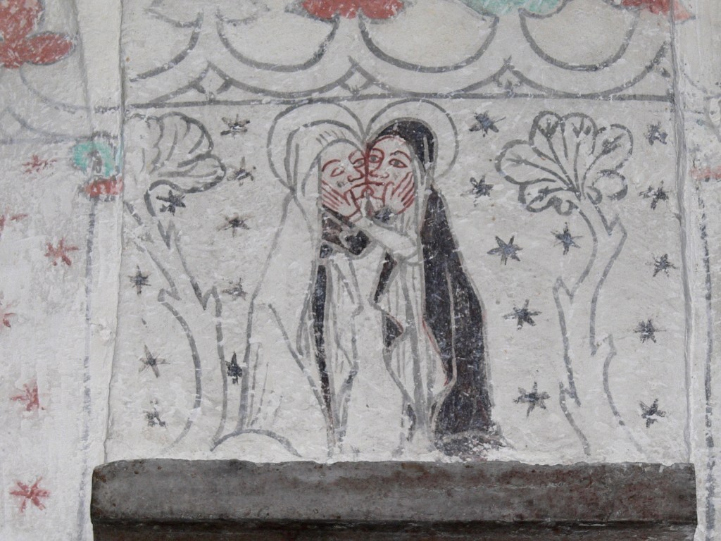 An image of two women exchanging a kiss and embrace in greeting. Both have halos, one sheds a tear.